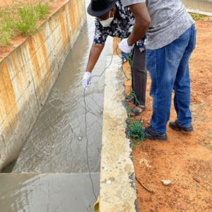 Laboratory staff undergo biosafety training on sampling collection procedures at thewaste discharge area of a rural hospital